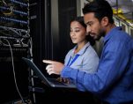 People, maintenance or laptop in server room, IT engineering or software programming ideas in cybersecurity. Repair woman, man or data center technology in teamwork collaboration for safety analytics