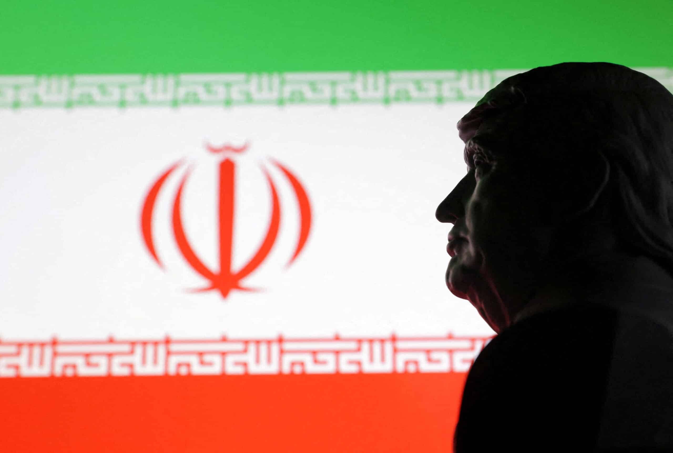 Illustration shows 3D printed miniature model of U.S. President Donald Trump and Iran flag
