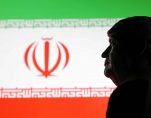 Illustration shows 3D printed miniature model of U.S. President Donald Trump and Iran flag